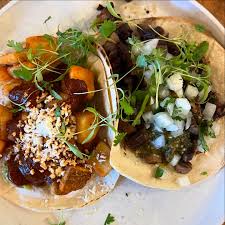 Puerta Mexicana signature dishes Birria TacosStreet CornTuna Tostada﻿﻿﻿